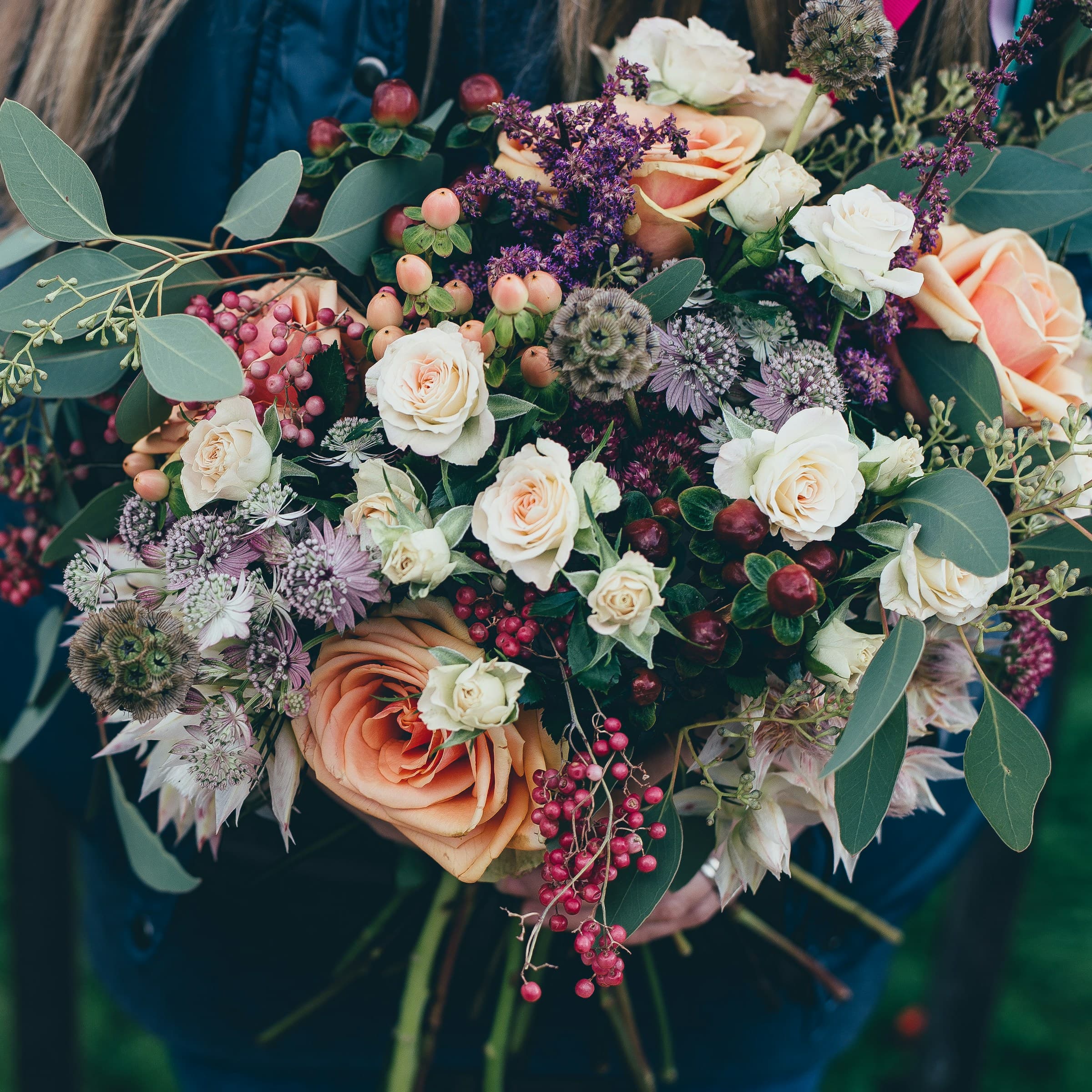 A loose bunch of garden roses in soft pinks