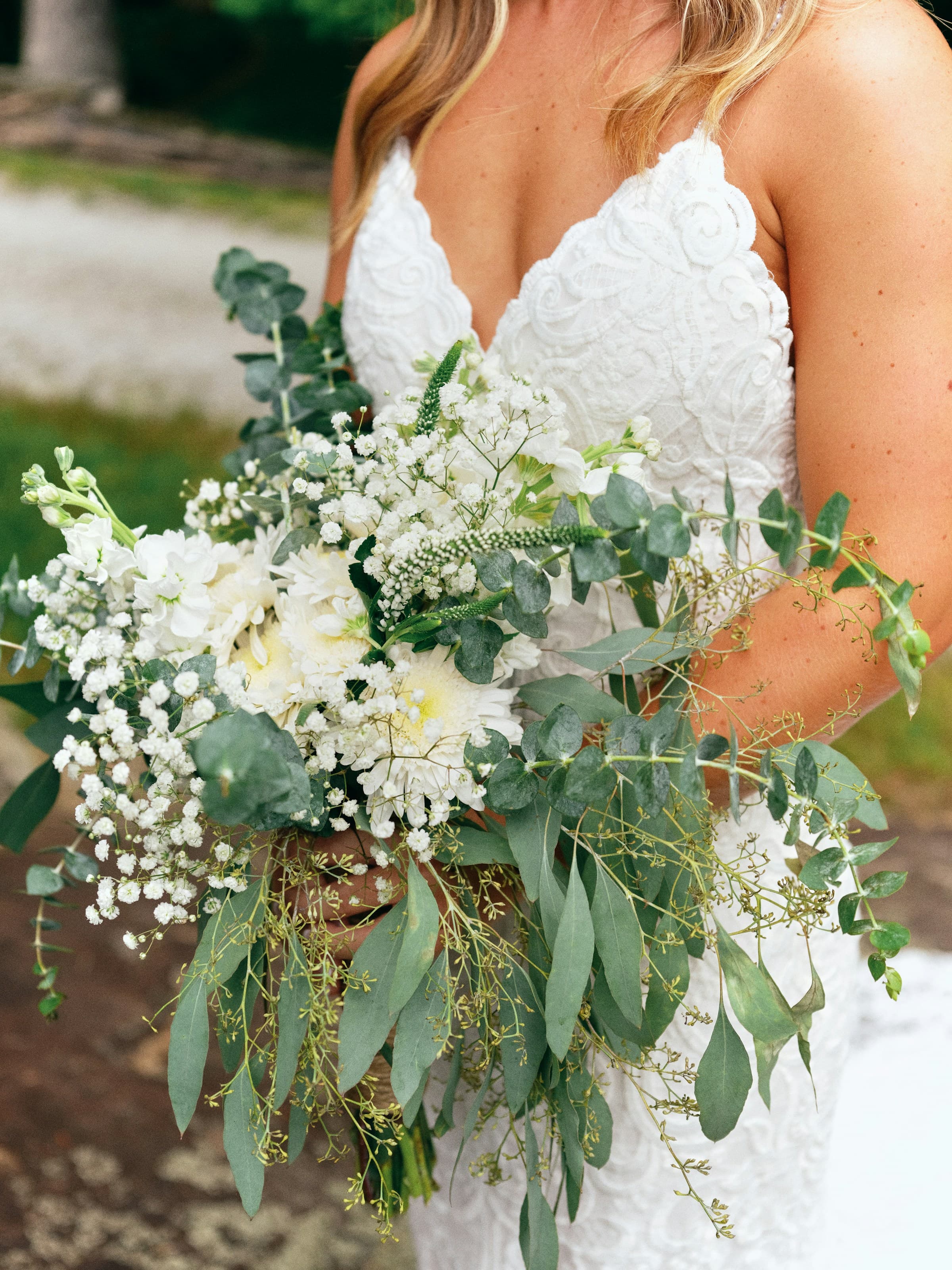 A bridal bouquet of soft pinks and greens with eucalyptus